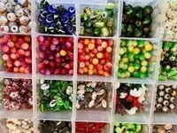 © Perles de verre - DR/O.T. Le Corbier
